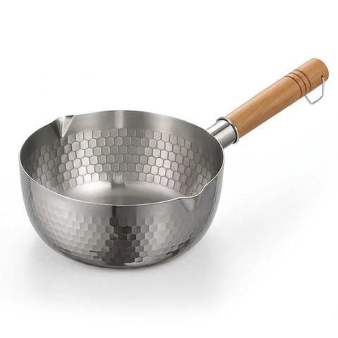 A stainless steel saucepan with a hammered hexagonal pattern exterior and a light brown wooden handle, shown on a white background.