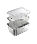 A stainless steel multi-tier food storage container set with a clear plastic lid, shown on a solid white background.