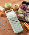 Vegetable slicer with sliced vegetables on a wooden surface