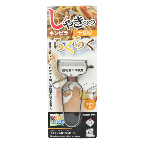 Japanese packaging for a stainless steel julienne peeler, featuring a clear plastic window showing the beige-and-black handled tool inside a printed card with product imagery and text.