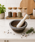 Mortar and pestle with spices on a kitchen counter