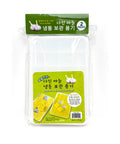 Packaged garlic freezer containers with green labels on a white background