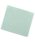 Green textured silicone square trivet on a white background