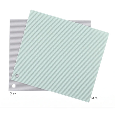 Two rectangular mats, one gray and one mint green, on a white background.
