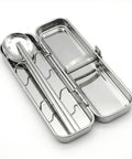 Stainless steel cutlery set in a case on a white background