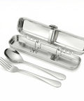 Stainless steel cutlery set with case on a white background