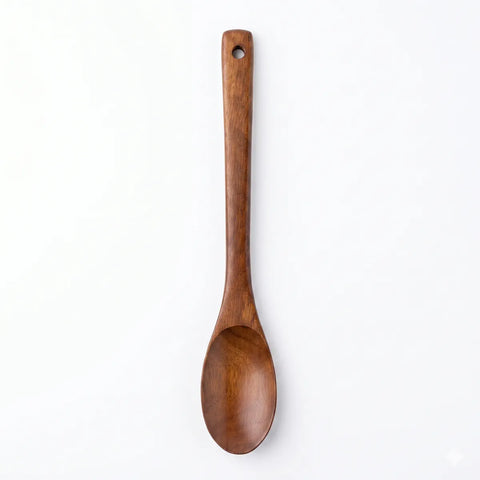 Wooden spoon on a white background