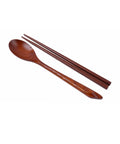 Wooden spoon and chopsticks on a white background