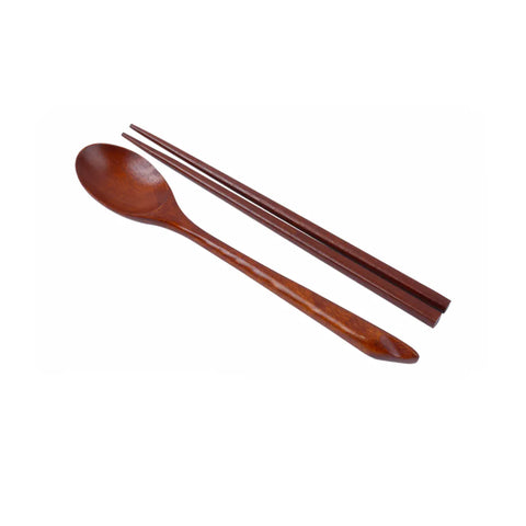 Wooden spoon and chopsticks on a white background