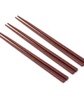 Set of wooden chopsticks on a white background