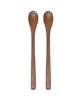 Two wooden spoons on a white background
