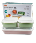 Set of food storage containers with a packaging box displaying images of vegetables.