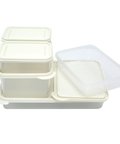 Set of white food storage containers with lids on a white background