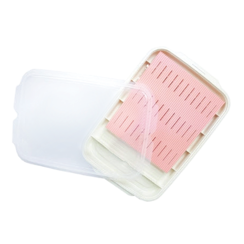 Pink and white food storage prep container on a white background