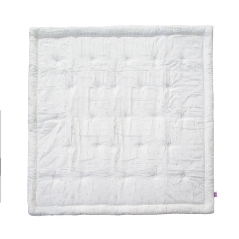 White quilted baby blanket on a white background