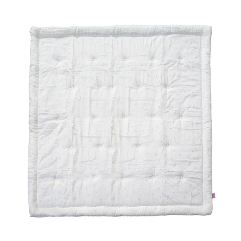 White quilted blanket on a white background