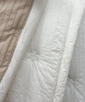 Close-up of textured beige and white fabric