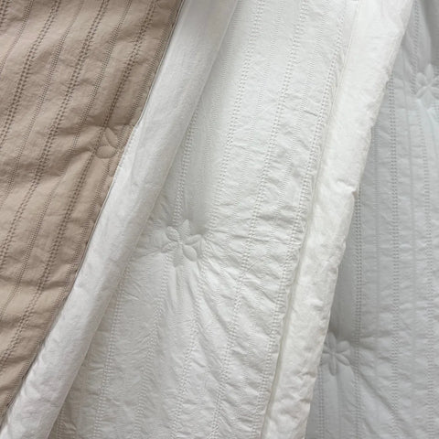 Close-up of textured beige and white fabric