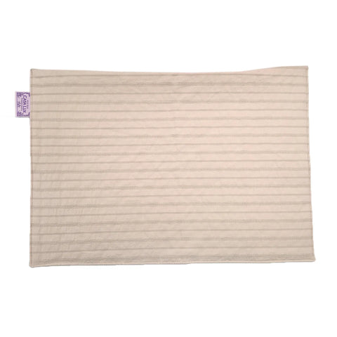 Beige pillow cover with a purple label on a white background