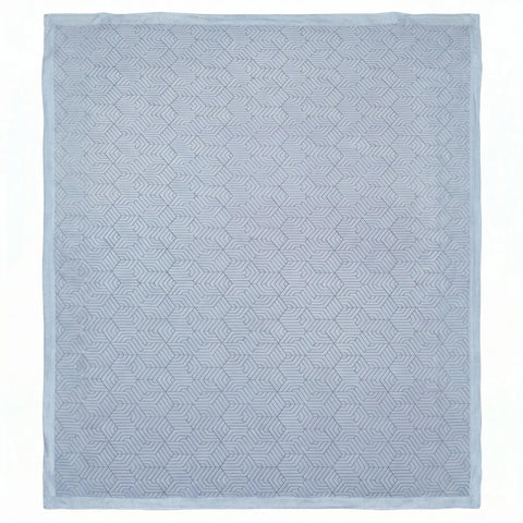 Light blue geometric patterned mattress pad on a white background