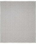 Gray geometric patterned mattress pad on a white background
