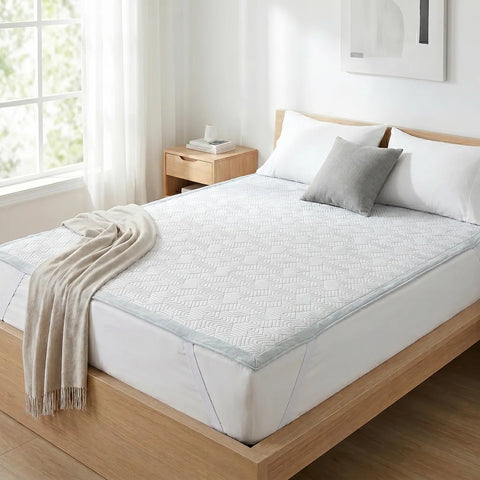 Bed with white bedding and a wooden headboard in a bright bedroom.