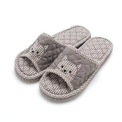 Pair of gray checkered slippers with cat face design on a white background