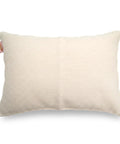 Beige ribbed pillow on a white background