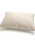 Beige pillow on a white background