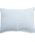 Light blue textured pillow on a white background