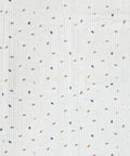 Textured fabric with small colorful specks on a white background