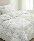Floral bedding set on a bed in a bright bedroom