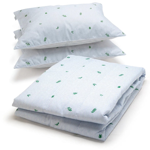 A bedding set including a folded comforter and two stacked pillowcases, all featuring a light blue and white stripe pattern with small green leaf motifs, set against a plain white background.