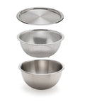 Set of steel kitchen bowl and colander with lid on a white background