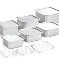 Set of stainless steel food container pans with wire racks on a white background