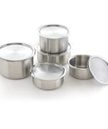 Set of stainless steel containers with lids on a white background