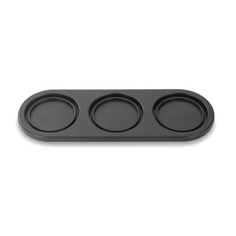 Black three-compartment tray on a white background