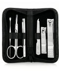 Manicure set with scissors, clippers, and tweezers in a black case on a white background