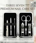 Three Seven 777 premium nail care set with tools in a black case on a marble surface.