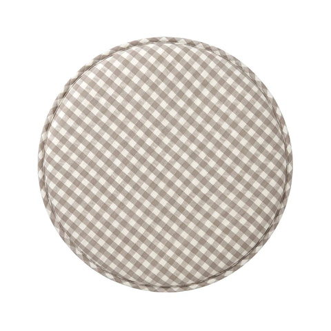 Round checkered cushion with a beige and white pattern on a white background