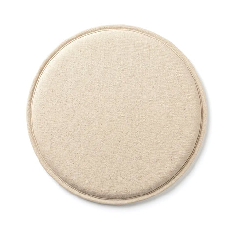 Round beige cushion on a white background