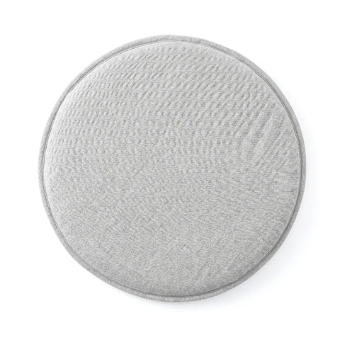 Round gray seat cushion on a white background
