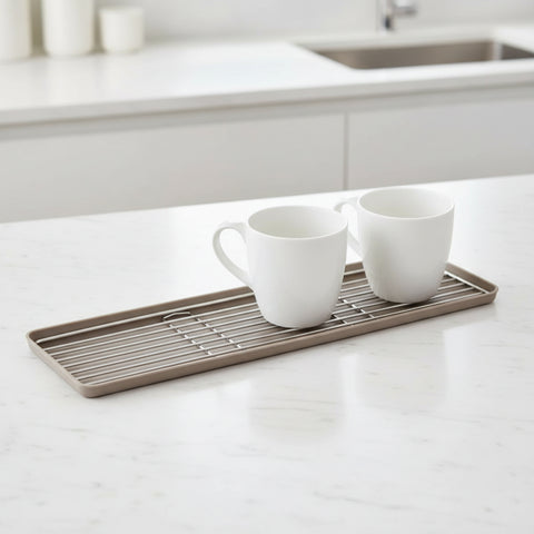 Two white mugs on a metal and silicone cup tray with a white background