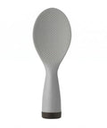Gray silicone rice paddle on a white background