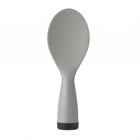 Gray silicone rice paddle on a white background