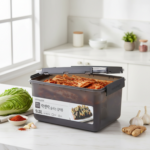 Kimchi stored in a black Lock and Lock container with Korean labeling in a white and modern kitchen
