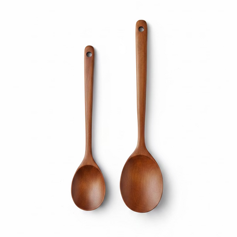 Two wooden serving spoons displayed on a white background.