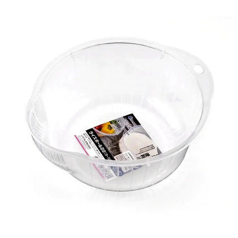 A clear plastic pet feeding bowl with a handle on the right side, shown on a white background with its retail packaging card inside.