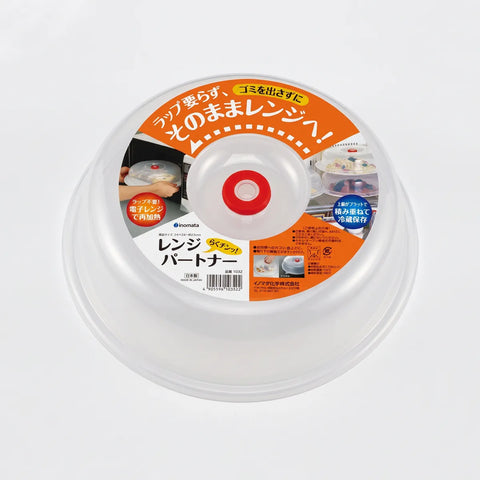 A clear plastic lid insert with a white and orange label featuring Japanese text and product usage images, photographed on a light gray background.
