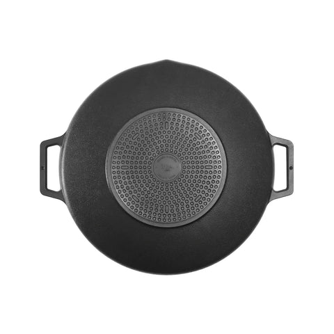 Black cast iron skillet with handles on a white background